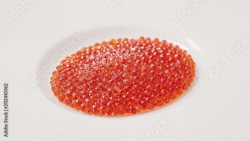 Rich red caviar on a white background, emphasizing its texture and color.