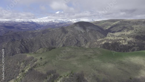 A drone video of the Caucasus Mountains, the Dzhily‑Su Valley, and the Pkhia Pass, Arkhyz, Russia, 2026.

