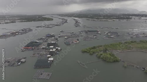 Aerial drone footage of oyster farming in Long Son, Ho Chi Minh City, Vietnam, showcasing traditional aquaculture, floating oyster farms, coastal fishing industry and sustainable seafood production.