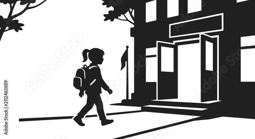 A young student with a backpack walking toward the entrance of a school building in a black and white silhouette