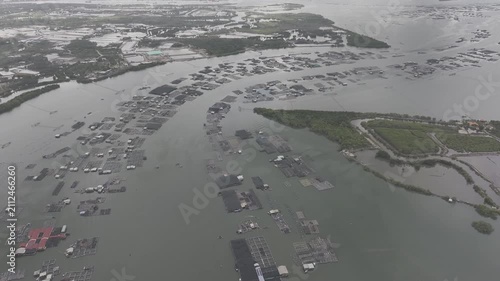 Aerial drone footage of oyster farming in Long Son, Ho Chi Minh City, Vietnam, showcasing traditional aquaculture, floating oyster farms, coastal fishing industry and sustainable seafood production.