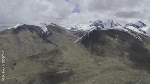 A drone video of the Caucasus Mountains, the Dzhily‑Su Valley, and the Pkhia Pass, Arkhyz, Russia, 2026.

