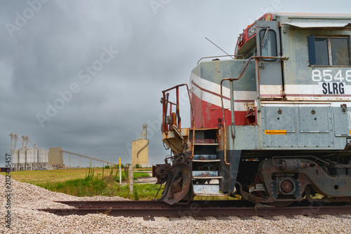 Retired freight locomotive awaiting further use or dismantling on an industrial site in North Texas USA,