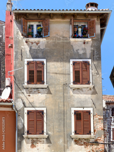 Old Apartment Building Facade With Flower Boxes