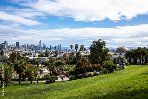 San Francisco skyline view from Dolores Park with palm trees