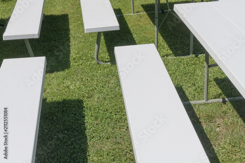 picnic tables outdoors in the sun