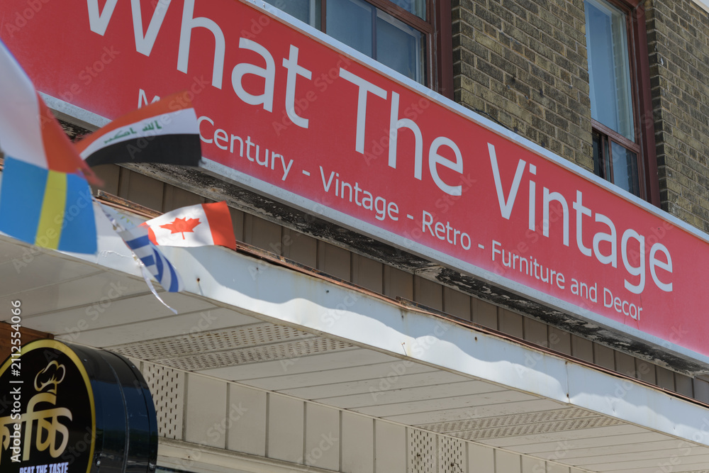 Fototapeta premium exterior building facade and sign of What The Vintage, a furniture store, located at 2468 Kingston Rd, Scarborough, Toronto