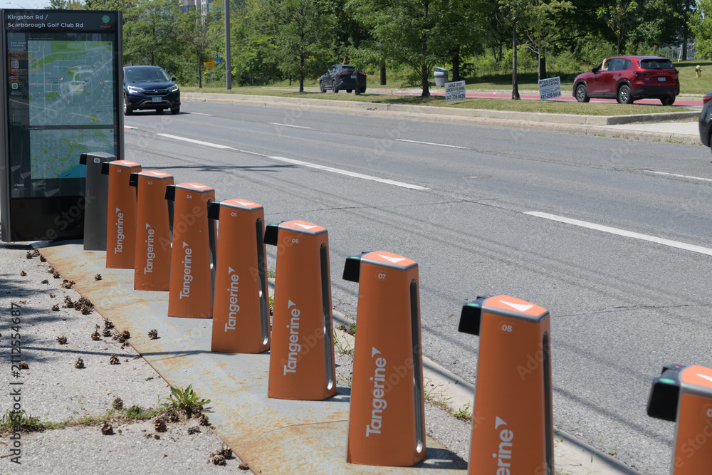Obraz premium wide, perspective view of a Bike Share Toronto docking station (without rental vehicles) at Kingston Rd and Scarborough Golf Club Rd