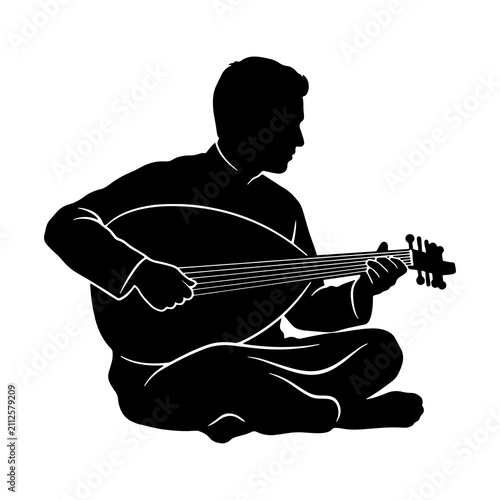 Fotografie Silhouette of a musician sitting cross legged playing an oud or lute string inst