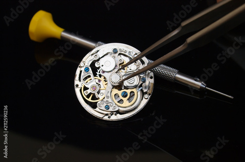 Watchmaker repairing vintage watch mechanism precise craftsmanship concept