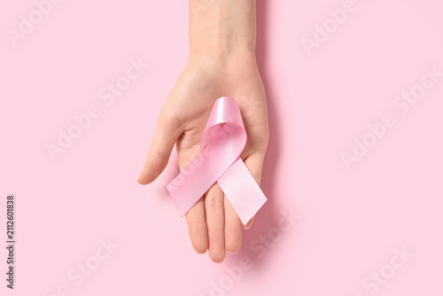 Female hand holding a pink ...