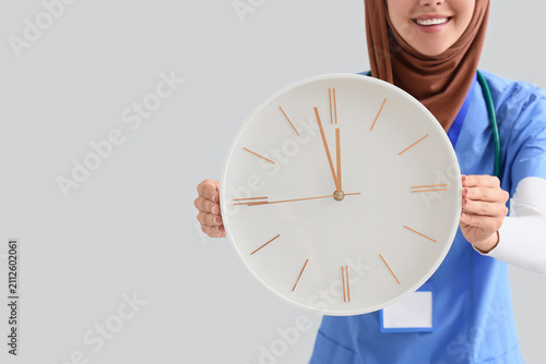 Smiling muslim female docto...