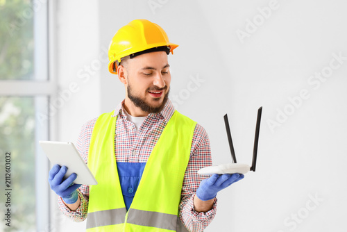 Smiling male technician in ...