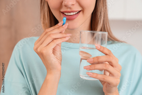 Young woman taking a blue c...