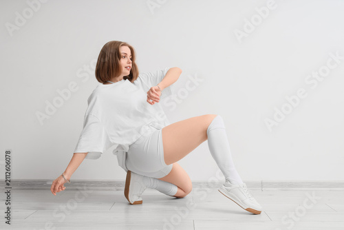 Young woman in white sports...