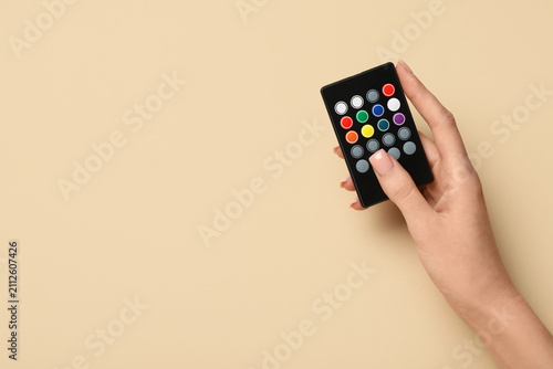 Female hand with remote con...