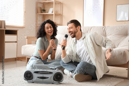 Young couple with microphon...