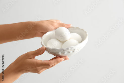 Female hands with bowl of b...