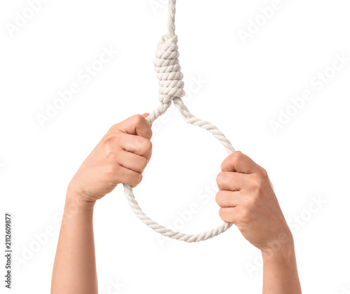 Foto Female hands and hanging rope with loop on white background