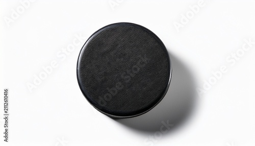 top view of a black hockey puck isolated on white background