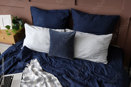 Big bed with navy blue line...