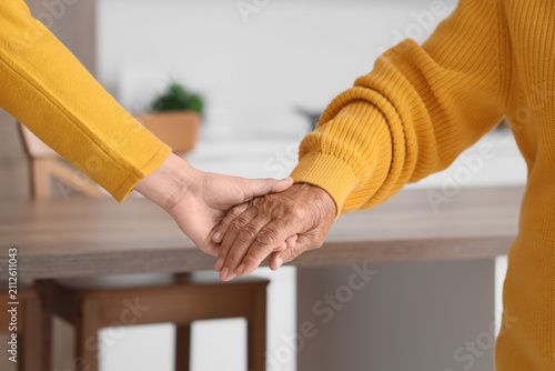 Woman with grandmother hold...