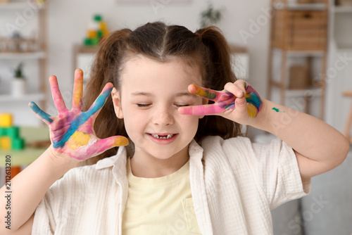 Happy little girl with colo...