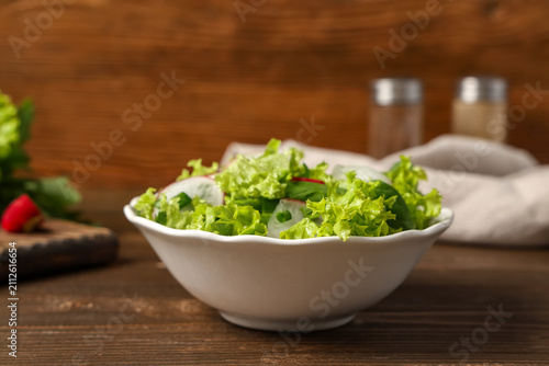 Bowl of tasty salad with ra...