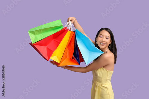 Young Asian woman with shop...