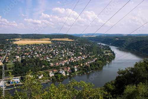 Quadro su tela Panoramic view of Vrané nad Vltavou and the Vltava River amidst forested hills and summer countryside