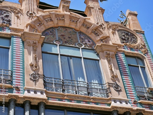 Fotografie Grand Modernist Building Facade with Ceramic Tiles and Arches