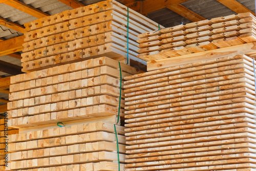 Piles of wooden boards in the sawmill, planking.
