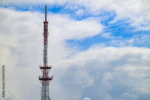 Принти на полотні Tall red and white communications tower rises skyward