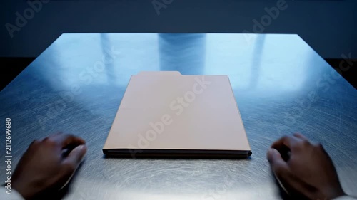 Professional Hands Resting on Empty Folder in a Polished Conference Table Setting Ideal for Business and Corporate Situations