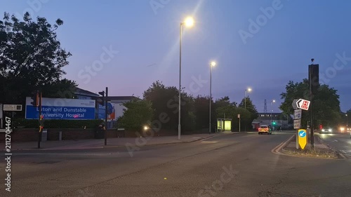 Low Angle Illuminated Streets View of Luton City of England United Kingdom During Orange Sunset Evening. Wide Angle Camera Footage Was Captured During Walk at Night of July 23rd, 2026.