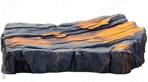 A layered rock formation displays textured surface with fiery orange highlights