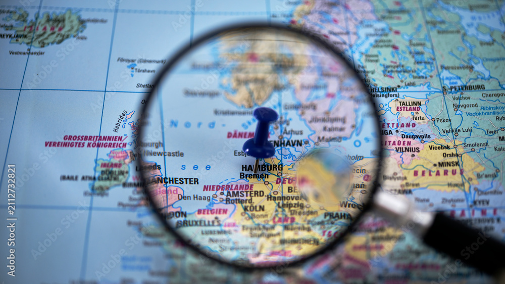 Fototapeta premium Bremen on paper map with magnifying glass and push pin