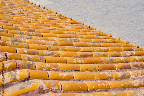 Weathered Terracotta Roof Tile Pattern with Rustic Mediterranean Architecture Texture Background