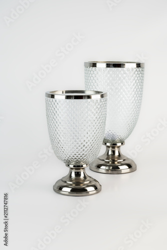 Two patterned glass goblets with silver trim