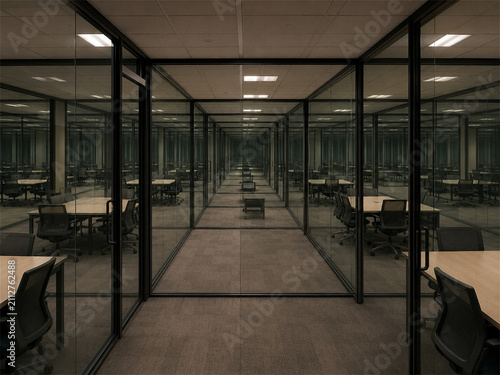 Empty glass walled corporate office corridor with repeating workstations and dark reflective panels creating an endless liminal workplace atmosphere of isolation order and modern business backrooms