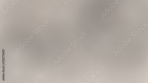 Abstract smooth gradient background in soft grey and beige tones.