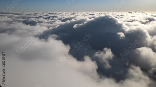 Aerial view of thick white clouds from above. Aerial view of dense white clouds for travel and nature projects