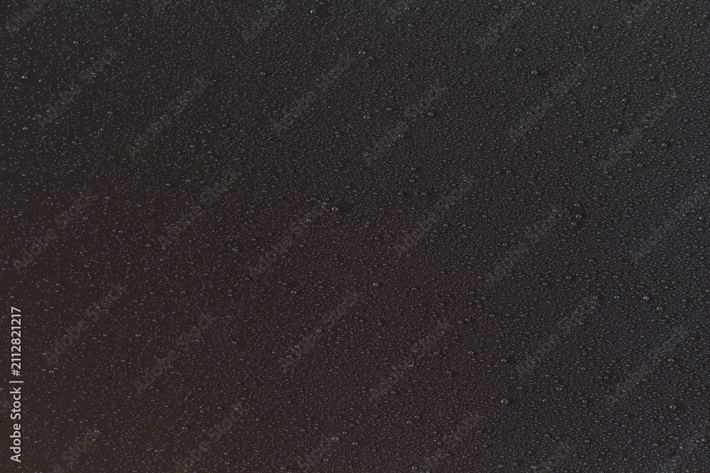 Obraz premium Fine water mist droplets on black background texture