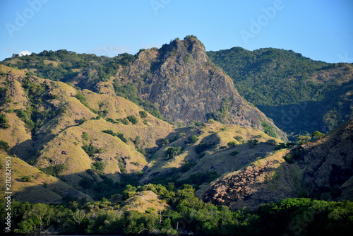 Obraz na plátně A beautiful landscape featuring cliffs and small hills around Padar and Rinca Islands, Labuan Bajo, Indonesia, on a clear morning