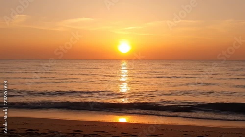 Panoramic sunset by the sea, golden sea surface at sunrise