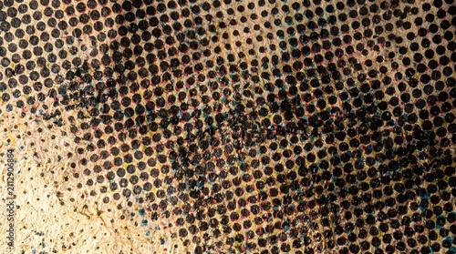 Vintage halftone dot pattern printed on aged newsprint paper texture