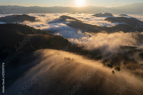 Landscape of Morning Mist with Mountain Layer. mountain ridge and clouds in rural jungle bush forestLandscape of Morning Mist with Mountain Layer. mountain ridge and clouds in rural jungle bush forest