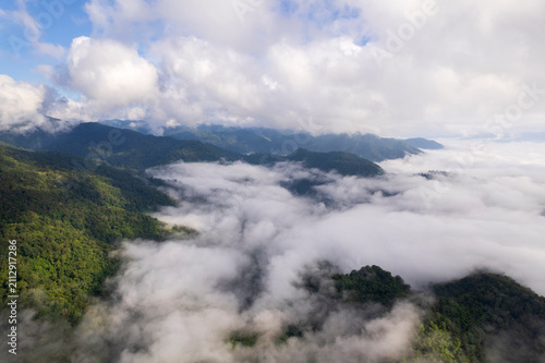 Landscape of Morning Mist with Mountain Layer. mountain ridge and clouds in rural jungle bush forest
