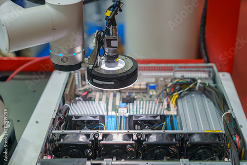 Machine Vision Camera on Robotic Arm Inspecting Electronics