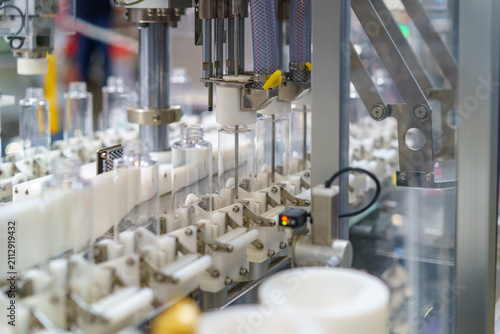 Automated Industrial Machine Processing Clear Plastic Bottles